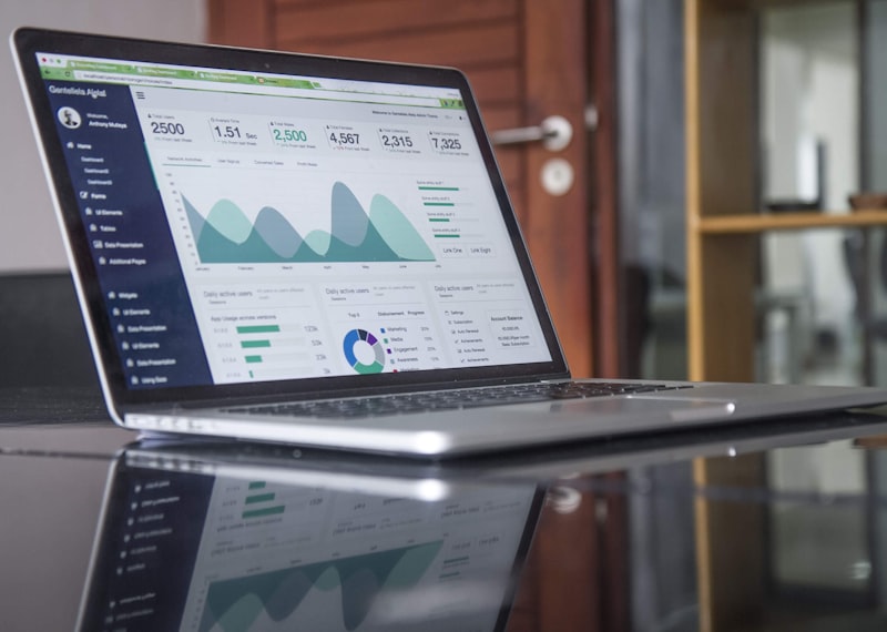 Stock investment portfolio on laptop screen showing diversified holdings
